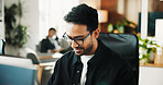 Man, computer and review with smile at office for software development, notes and insight at tech company. Person, programmer and happy with glasses, coding and problem solving at startup IT agency