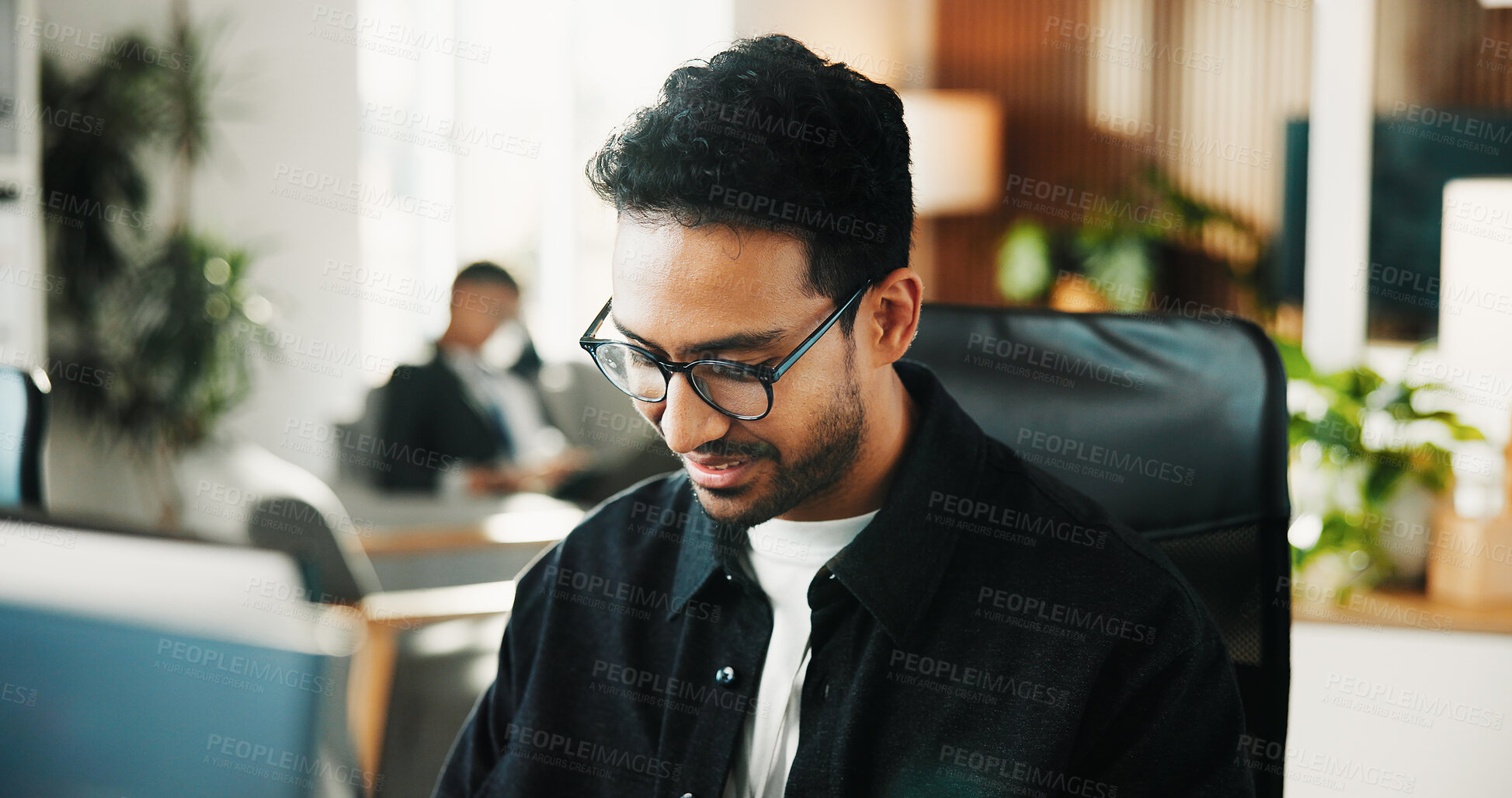 Buy stock photo Man, computer and review with smile at office for software development, notes and insight at tech company. Person, programmer and happy with glasses, coding and problem solving at startup IT agency