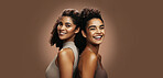 Portrait, skincare and happy women in studio with makeup, bonding together and support for beauty. Space, female friends and confident with glowing skin, cosmetics or dermatology on brown background.