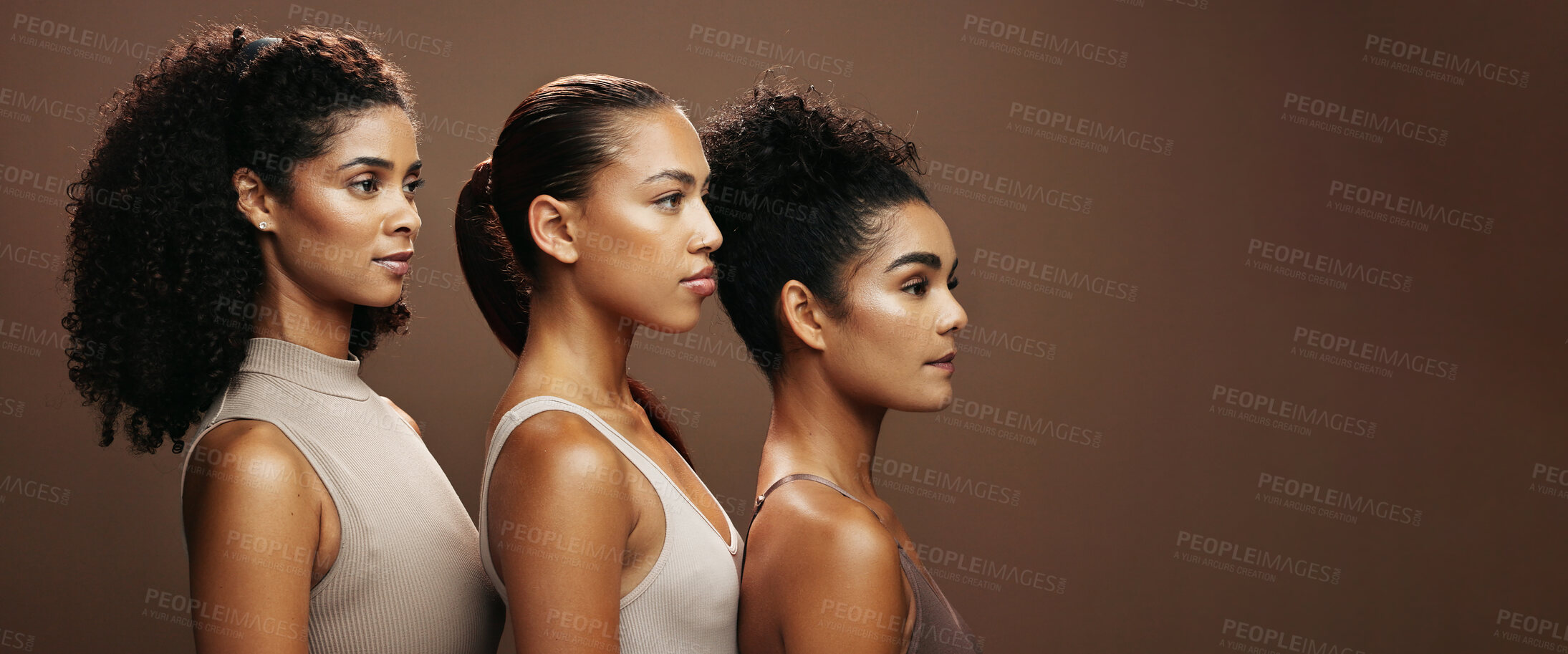 Buy stock photo Women, skincare and makeup in studio for beauty, empowerment or inclusion on a brown background. Female people, model or glow up in row on banner with shine for cosmetics or cosmetology on space