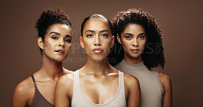 Buy stock photo Portrait, confident or friends with skincare in studio, natural cosmetics or self care for wellness glow. Dermatology, group and women with pride for skin transformation, beauty and brown background