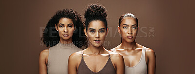Buy stock photo Women, portrait and skincare with makeup in studio for beauty or empowerment on a brown background. Female people, model or glow up in row on banner with shine for cosmetics or cosmetology together