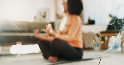 Buy stock photo Incense stick, meditation and woman in home lounge for wellness, self care and lotus for zen. Person, yoga and smoke for aromatherapy to meditate, relax and calm in house with fragrance or scent