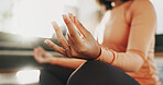Meditation, hands and woman with lotus pose in home for calm, relax or mindfulness in morning. Peace, yoga and female person in living room with self care, health or wellness in healing at apartment.