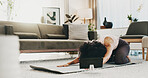 Woman, yoga mat and tablet in home for stretching, tutorial or online course for childs pose on floor. Person, smile and tech for virtual class, fitness or streaming subscription on app at apartment