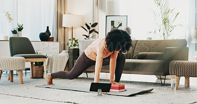 Buy stock photo Woman, yoga and block on floor with tablet, online class and stretching for holistic health in home. Fitness, person and balance exercise in living room with lunge, pilates or tech for video tutorial