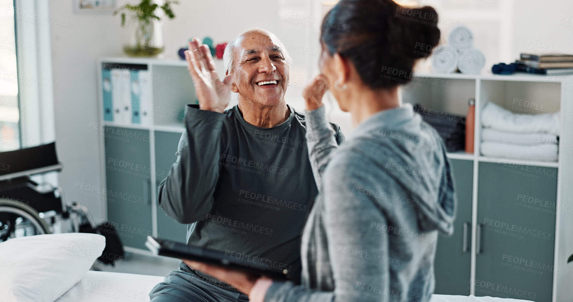 Buy stock photo Physiotherapist, tablet and old man in clinic with high five, medical help or good news for healing. Healthcare worker, tech and senior person with celebration, smile or physical therapy for recovery