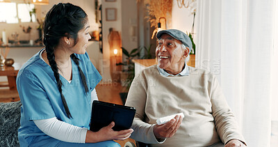 Buy stock photo Medicine, nurse and tablet with old man in assisted living for healthcare advice or instructions. App, explain and pill container with medical woman speaking to senior patient in retirement home