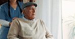 Caregiver, wheelchair and senior man thinking by window in nursing home for health care and memory. Elderly patient, wellness and nurse to help person a disability for hospice, space or retirement