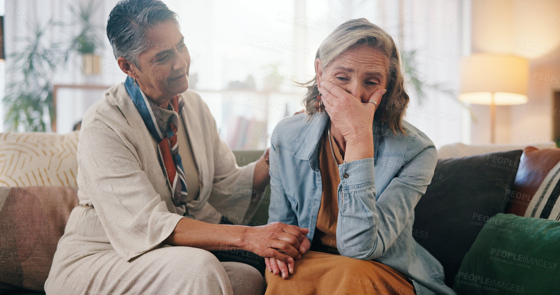 Buy stock photo Woman, crying and holding hands on couch with friends, support and compassion for healing from grief. Mature, people and empathy in house with trust, understanding or help to process trauma together.