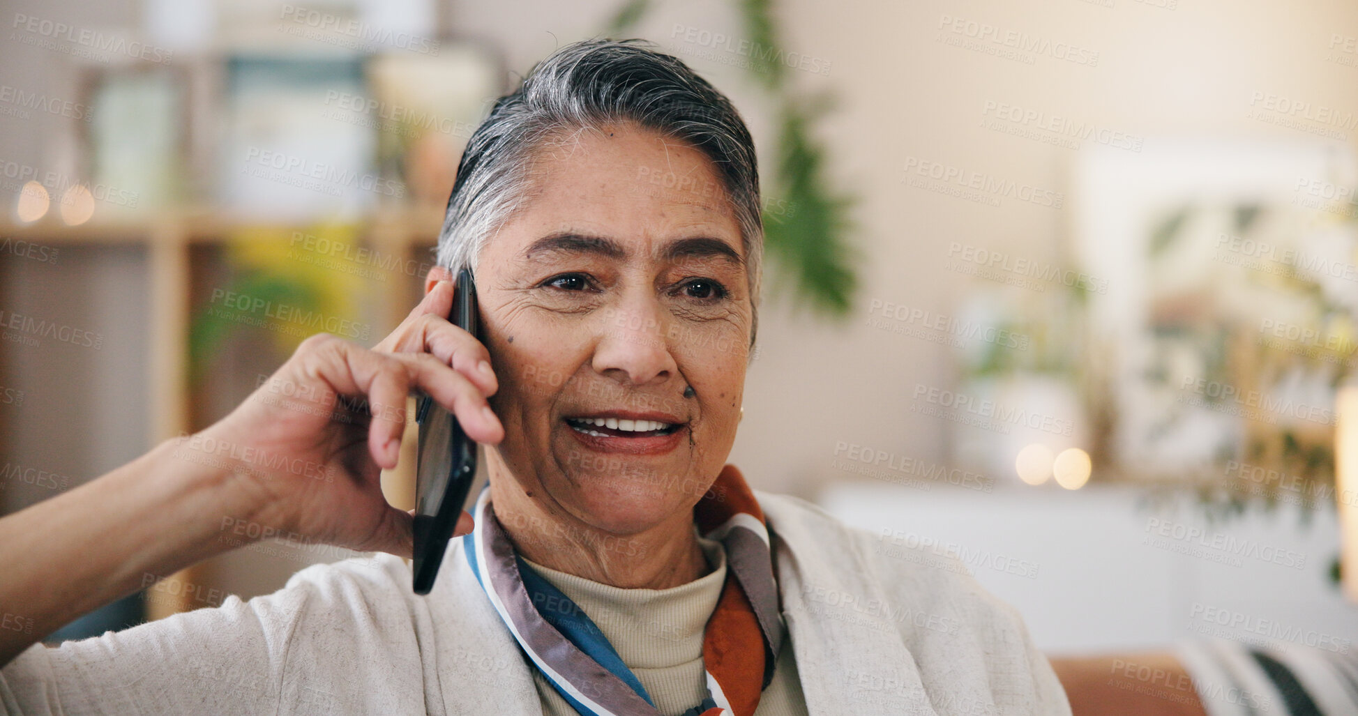 Buy stock photo Phone call, talking and senior woman in home, relax and digital app for communication. Happy, apartment and mature person on couch, smartphone for online chatting and conversation in living room