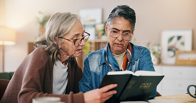 Buy stock photo Reading, bible and mature women in house with learning religion, praise or worship together. Holy book, bonding and female friends with studying for spiritual wellness in living room at apartment.