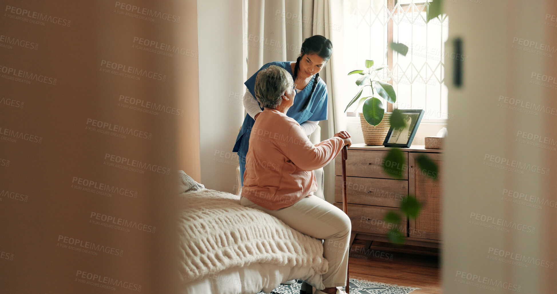 Buy stock photo Caregiver, help and old woman in nursing home with walking stick, support and conversation for healing. Space, nurse and senior person with disability, cane and rehabilitation in retirement center.