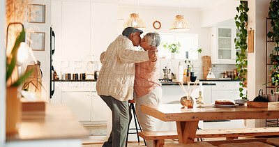 Buy stock photo Dancing, kiss and senior couple in kitchen, romance and retirement fun for anniversary celebration. Home, bonding and elderly people with affection for healthy relationship, marriage support and love