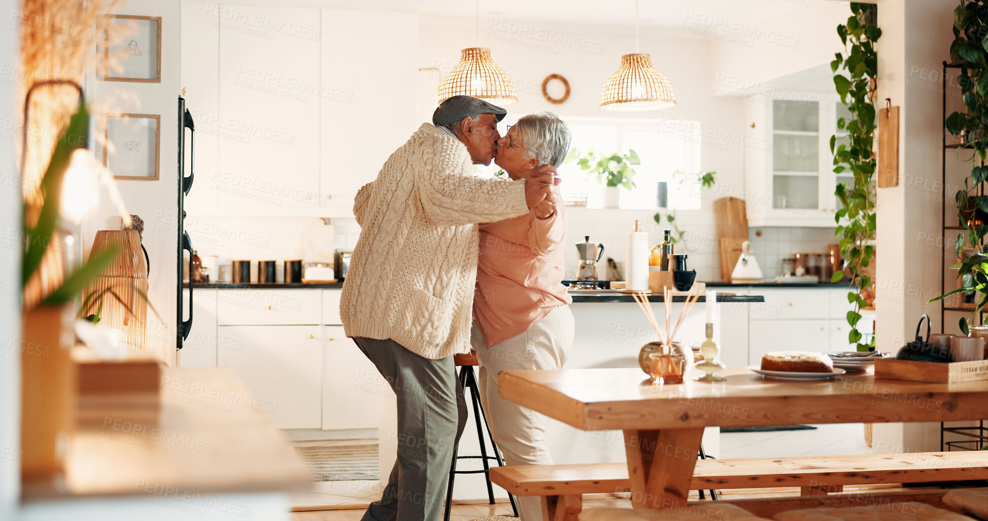 Buy stock photo Dancing, kiss and senior couple in kitchen, romance and retirement fun for anniversary celebration. Home, bonding and elderly people with affection for healthy relationship, marriage support and love