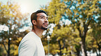 Runner, man and thinking of fitness at park, serious and rest after workout and training in morning. Outdoor, athlete and person in nature post exercise, space and cool down on break and low angle
