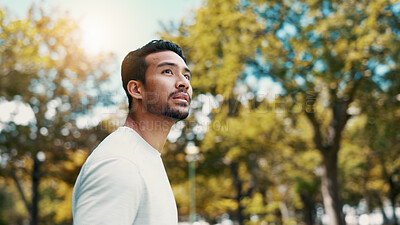 Buy stock photo Runner, man and thinking of fitness at park, serious and rest after workout and training in morning. Outdoor, athlete and person in nature post exercise, space and cool down on break and low angle