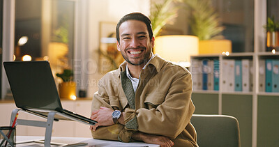 Buy stock photo Creative, laptop and happy man with arms crossed in business, portrait or writer with pride at night. Newsroom, deadline and person with smile for career growth, publishing and working late with tech