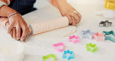 Buy stock photo Hands, mother and child baking with dough for learning, culinary skills and bonding together. Person, kid and helping with rolling pin, preparing pastry and teaching recipe for handmade snack in home