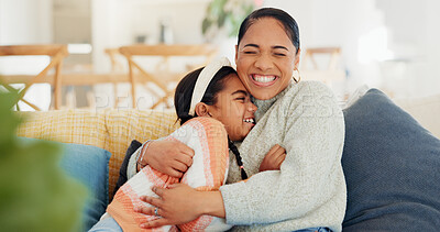 Buy stock photo Mother, child and hug on sofa with smile, connection and love for bonding together on weekend break. Happy, woman and daughter embrace in home with kindness, wellness and support for development.