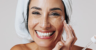 Buy stock photo Skincare, portrait and woman with dropper in studio, hyaluronic acid treatment or anti aging product. Smile, glowing skin or mature person with wrinkle serum for hydration, beauty or white background