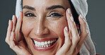 Happy woman, portrait and studio with moisturizer for skincare or dermatology on a gray background. Female person, model or smile with smooth skin, glow or shine for beauty cosmetics or hydration