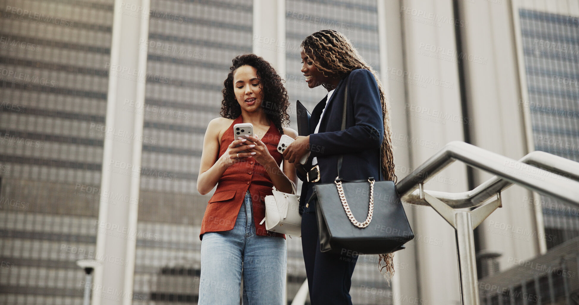 Buy stock photo Happy woman, phone and share in city with friends, discussion or chat for networking on commute. People, outdoor and social media on smartphone, mobile app or talk in low angle on trip in urban town