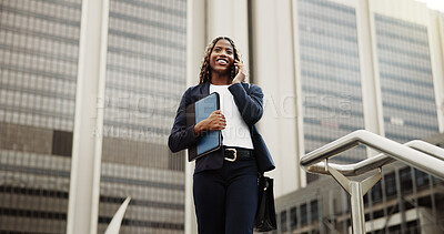 Buy stock photo Low angle, real estate and black woman in city, phone call for rental agreement and viewing schedule. Outdoor, realtor and happy person with cellphone, talking to contact and property question
