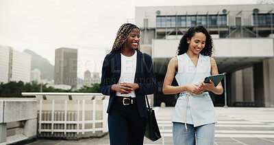 Buy stock photo Smile, tablet and walking with business women outdoor together for feedback, report or update. App, conversation and digital with happy people at building in city for online planning or research