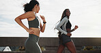 Friends, women and running for fitness in city with marathon practice, pace training and health. Happy, runners or active with jog on bridge for race exercise, sport performance or wellness challenge