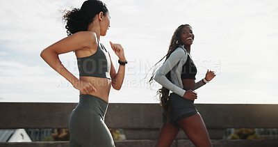 Buy stock photo Friends, women and running for fitness in city with marathon practice, pace training and health. Happy, runners or active with jog on bridge for race exercise, sport performance or wellness challenge