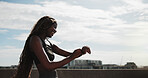 Happy, runner and black woman with watch in city for exercise, health app and fitness tracker. Sports, space and person check time for training, workout progress and active hobby with blue sky