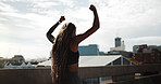 Runner, woman and fitness celebration outdoor for running goal, cardio achievement or milestone. Active, back or athlete with fist pump in city for exercise target, health success or personal victory