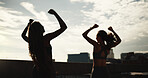 Sunset, women or fitness celebration in city for exercise goals, marathon pace target or victory. Back, friends and runners with fist pump on bridge for cardio success, workout milestone and sunshine