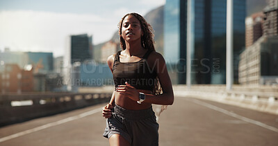 Buy stock photo Athlete, woman and running for exercise in city with pace training, morning cardio and fitness. Active runner, black girl or jog on bridge for sport performance, wellness challenge and health workout