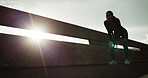 Fitness, tired and woman with break in city for cardio burnout, intense exercise or recovery. Flare, runner or exhausted person on bridge for running fatigue, endurance challenge or rest from workout