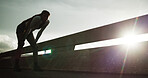 Athlete, tired and woman with breathing in city for cardio burnout, intense exercise or recovery. Flare, fitness or exhausted person on bridge for running fatigue, endurance challenge or workout rest