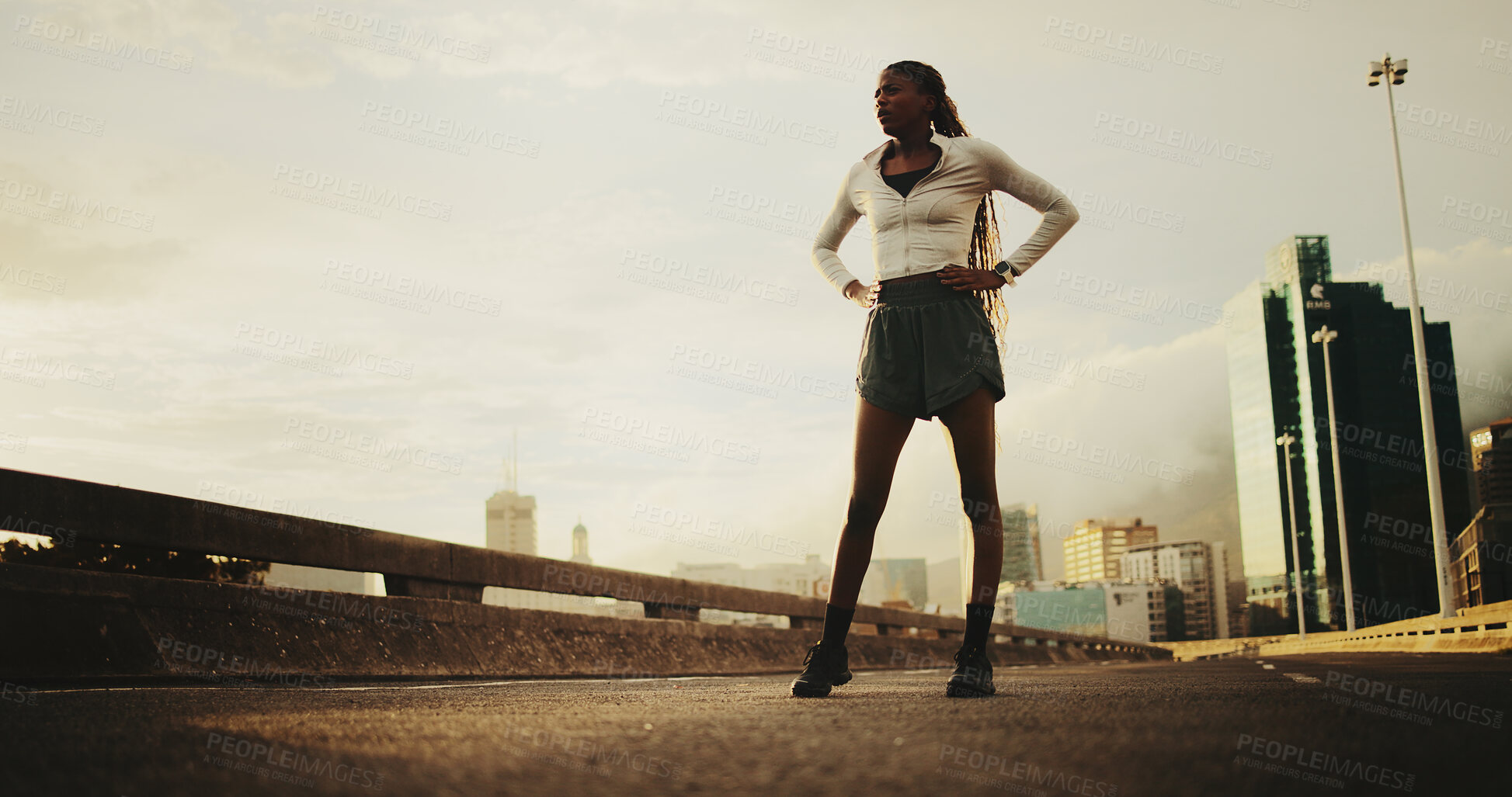Buy stock photo Exercise, tired and black woman in city for fitness, cardio workout or rest on bridge. Female person, space or runner on break by sky with low angle, sports and fatigue outdoor on urban street