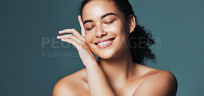 Buy stock photo Skincare, touch and woman with space in studio for cosmetics, makeup and dermatology. Mockup, happy and person with hands for beauty, spa and facial for wellness, salon and glow on blue background