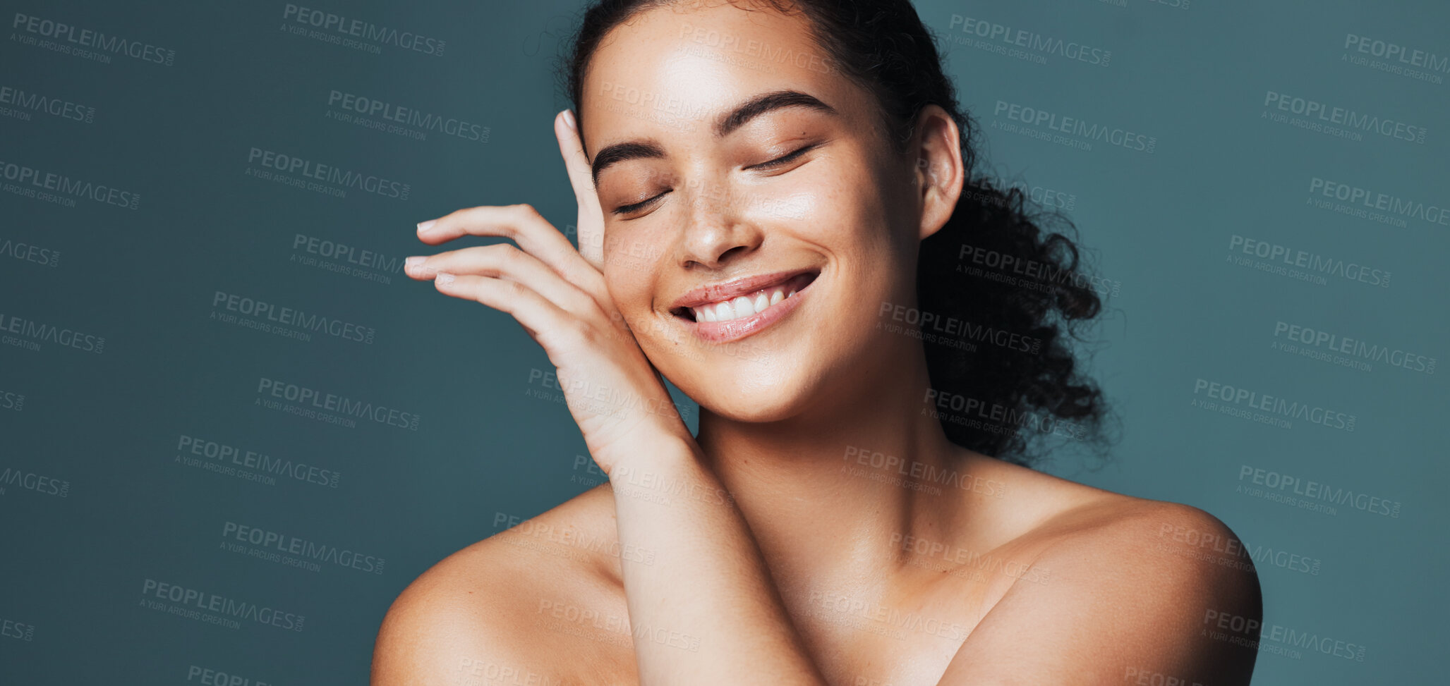 Buy stock photo Skincare, touch and woman with space in studio for cosmetics, makeup and dermatology. Mockup, happy and person with hands for beauty, spa and facial for wellness, salon and glow on blue background
