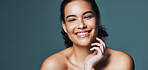 Skincare, happy and portrait of woman in studio for cosmetics, makeup and dermatology. Mockup, space and person with smile for beauty, salon and facial treatment for wellness on blue background
