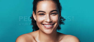 Buy stock photo Confident, portrait and skincare for happy woman in studio, wellness and cosmetics for healthy skin. Blue background, mockup space and person with pride for glow, dermatology and self care for beauty
