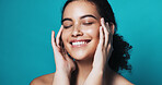 Skincare, touch and woman with smile in studio, wellness glow aesthetic and smooth texture for beauty. Facial shine, dermatology or person with happiness for soft skin, self care or blue background