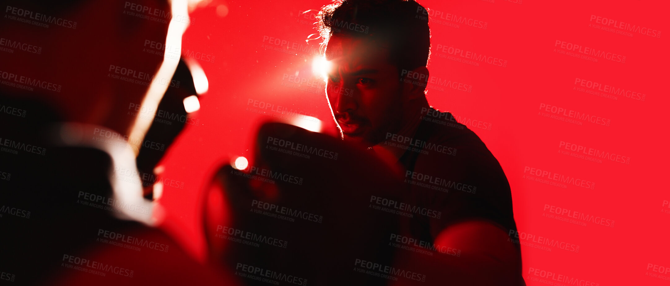 Buy stock photo Boxing, fitness and man in studio with gloves for training, workout or wellness with energy. Banner, sports and athlete with fight challenge for cardio exercise, health or practice by red background.