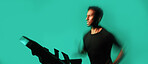 Man, running and treadmill in studio with fitness, endurance training and speed exercise for wellness. Active, person and runner with gym equipment, cardio workout and motion blur on blue background.