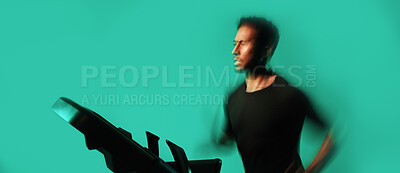 Buy stock photo Man, running and treadmill in studio with fitness, endurance training and speed exercise for wellness. Active, person and runner with gym equipment, cardio workout and motion blur on blue background.