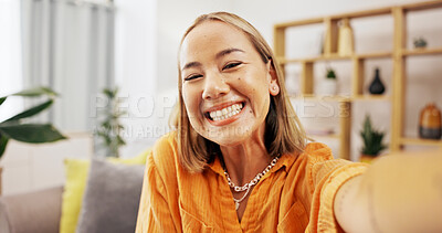 Buy stock photo Selfie, portrait and Asian woman in home with happiness, positive attitude or social media post on weekend break. Wellbeing, free time or person with good mood, optimism or memory capture in Thailand