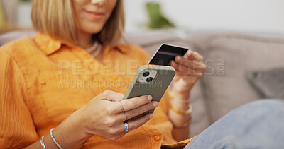 Buy stock photo Credit card, hands and woman with phone on sofa for online shopping, internet payment and digital purchase. Home, smartphone and person with bank info for subscription, website store and ecommerce