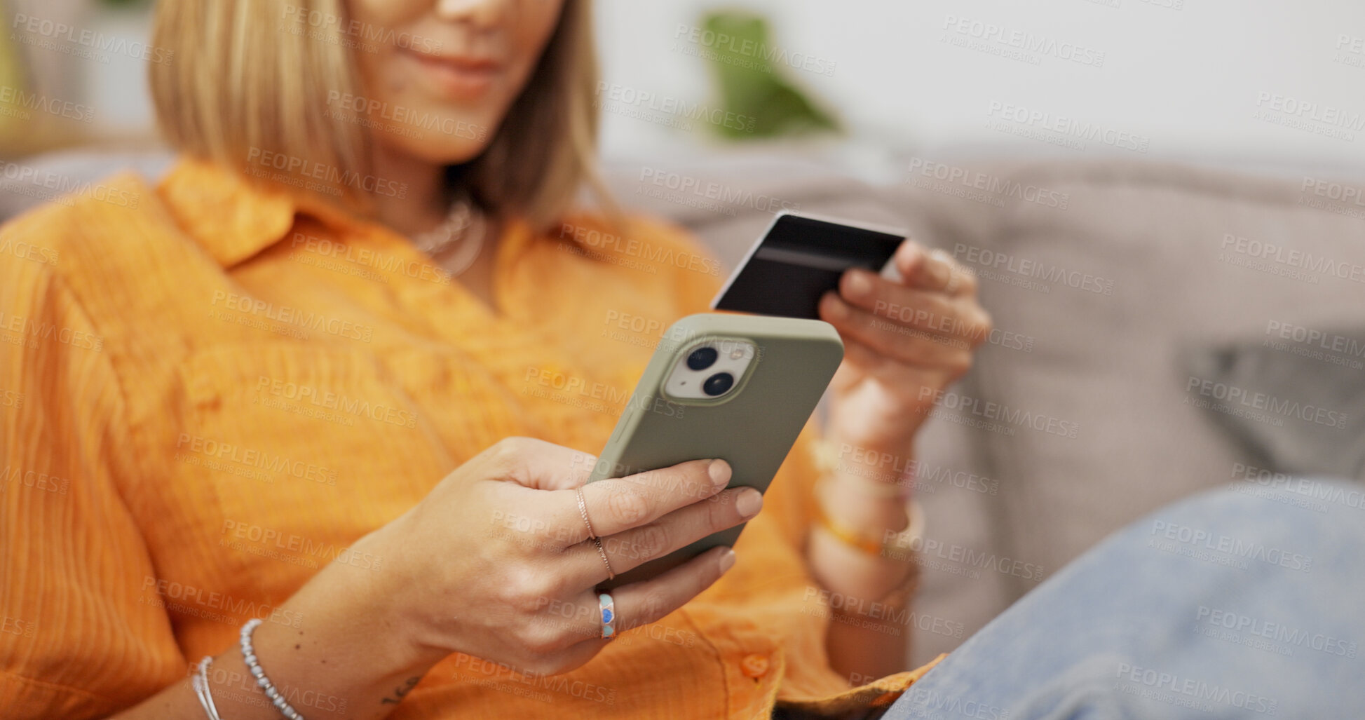 Buy stock photo Credit card, hands and woman with phone on sofa for online shopping, internet payment and digital purchase. Home, smartphone and person with bank info for subscription, website store and ecommerce