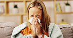 Sickness, blowing nose and tired with woman on sofa for fatigue, virus infection and flu season. Sinus allergy, disease and sneezing with person and tissue in living room of home for cold and illness